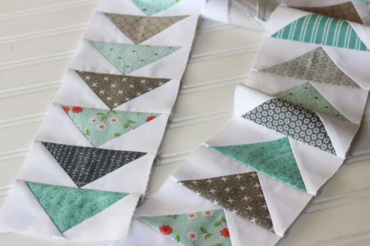 A flying geese block involves a rectangle block with an isosceles triangle in the middle. When stacked, these blocks symbolize a flock of geese going in the same direction. A high level of precision is required to create a stack of these repetitive blocks, so here are five ways you can achieve this!