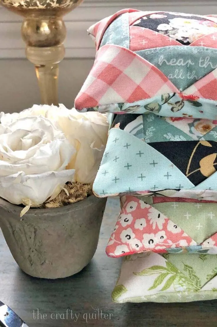 Take a look at this tutorial that shows you how to make a pincushion that has folded corners. The corners are formed by folding over multiple squares of fabric, and you can customise the corners by adding on a needle threader or a bobbin.