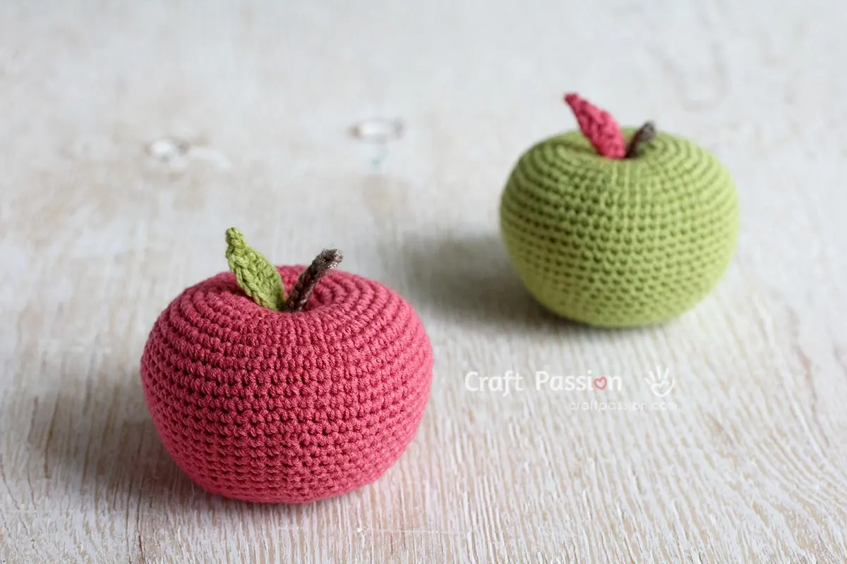 Free Crochet Apple Amigurumi Pattern that looks like a real apple. 
Add some characters to the crochet apple with
1. add a worm with its head sticking out from the apple. 
2. Add eyes and a smiling mouth with a rosy cheek for a kawaii look. 
3. Use rainbow-colored yarn to create a rainbow apple.