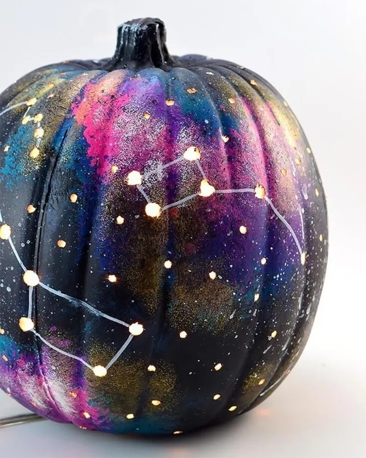 This Galaxy painted pumpkin is out of this world! Pair it with the moon and star pumpkin painting ideas, and you have a starry night and galaxy to decorate your porch with.