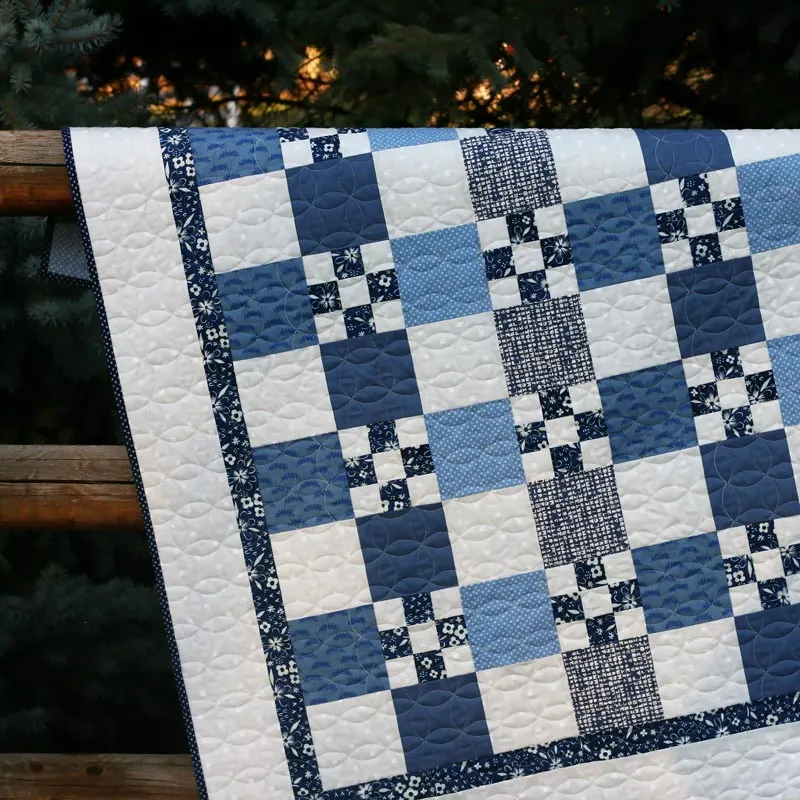 By using only 5 fat quarters some fabric for background and borders, you can make your rendition of this beautiful Garden Path quilt! It's made from 5" squares alternating with background squares and 9-patch blocks. The finished size of this piece is 50" x 50".&nbsp;