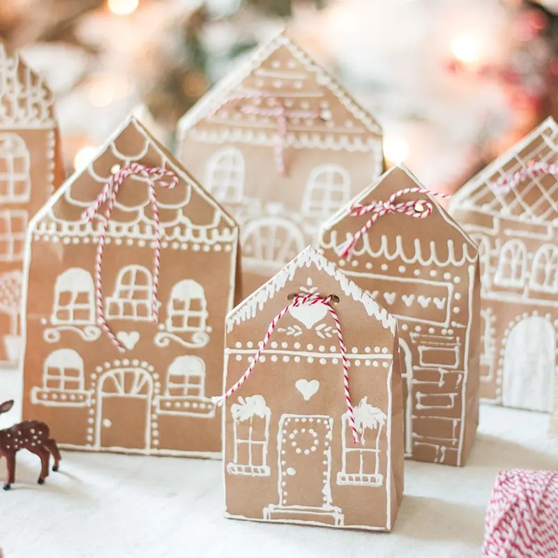 Turn basic brown paper bags into cute gingerbread houses with just a little white paint. They&rsquo;re the perfect way to wrap up holiday cookies. Plus, it&rsquo;s fun to imagine little gingerbread men living inside, spreading holiday cheer!