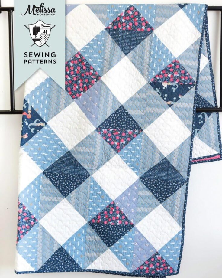 Learn how to quilt this soft and gorgeous Gingham Daydream Quilt by Polka Dot Chair! It&rsquo;s an advanced beginner and inexpensive pattern that&rsquo;s easy to piece and a great stash-buster project! It features a fast-piece method, making your quilt a fast-paced project. This PDF also offers various potential layouts from which you can choose. It&rsquo;s also available in five sizing options as follows: Crib (42&rdquo; x 51&rdquo;) Lap (51&rdquo; x 68&rdquo;) Twin XL (68&rdquo; x 93&rdquo;) Queen (85&rdquo; x 93&rdquo;) King (102&rdquo; x 102&rdquo;)