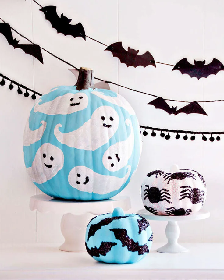Here come our scary pumpkin painting ideas for Halloween! With ghouls, spiders, and bats, you'll have your fair share of fun painting these pumpkins. And, of course, we can't forget the glitter, can we?