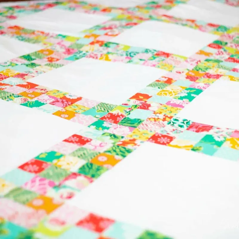 Quilt your very own throw quilt with this pattern! This charming pattern features classic lattice blocks that evoke memories of those nostalgic, cozy quilt days. Download the pattern now to sew a heartwarming quilt blanket for your grandma on Mother&rsquo;s Day. She will definitely appreciate the sweet gesture. Size: 77&rdquo; x 77&rdquo;