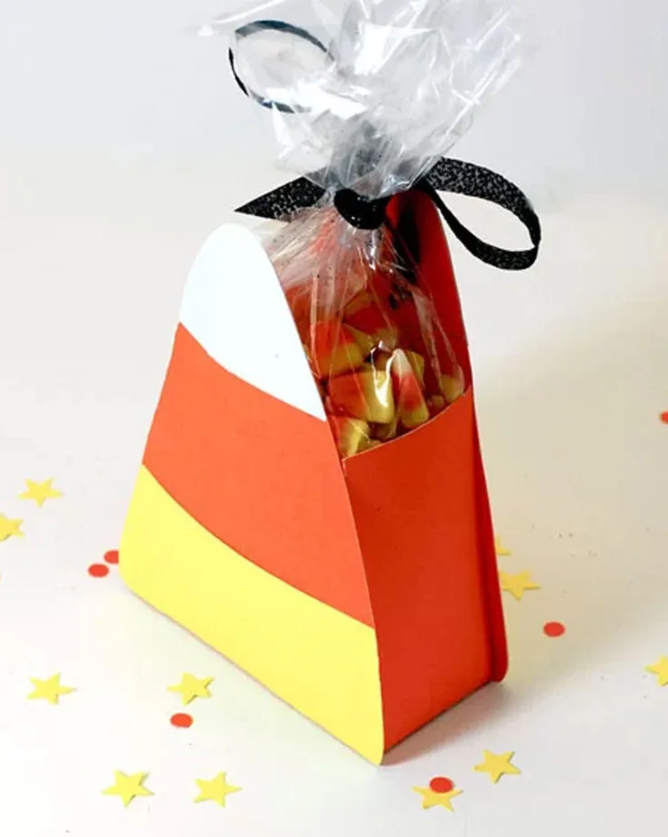 Check out this Halloween candy corn treat box! Free die-cut files are available for download for those with die-cut machines, but you can also cut them out manually using cardstock in classic candy corn colors. It&rsquo;s a fun and easy way to package up Halloween treats!