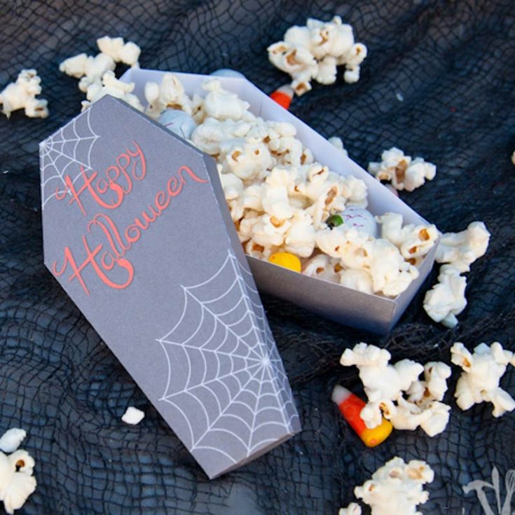 How fun are these free printable Halloween coffins treat boxes? Print them on cardstock, cut along the dark gray lines, and fill them with popcorn. Your guests will love the spooky touch and how their treats are served!