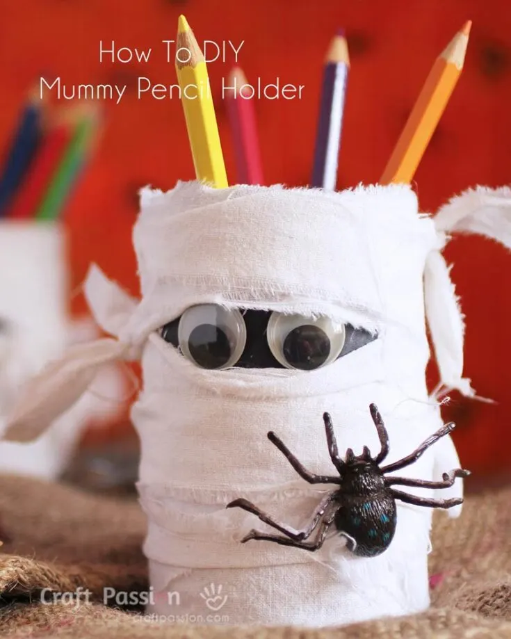Take a look at these spooky mummy pencil holders to spook up your study desk; they are perfect for a Halloween afternoon craft session. Using the same idea as the yarn pencil holder craft, substitute the yarn for torn white cloth strips and add some googly eyes peeking out from between the strips.