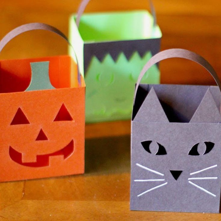 These Halloween paper treat box luminaries are super easy and adorable! They&rsquo;re perfect for holding small treats, but you can also turn them into charming luminaries by adding a tea light candle to brighten your Halloween!