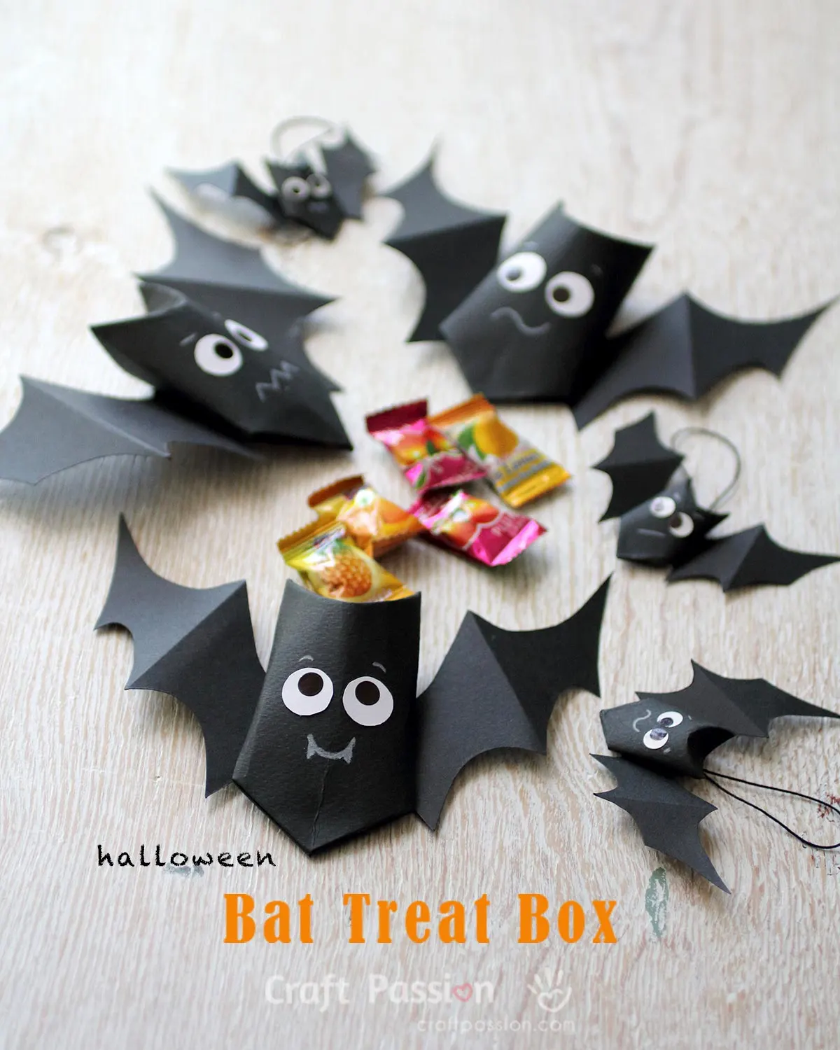 Make bat treat boxes with cute expressions using card stock or toilet paper roll. Fill up the Halloween Treat Bags with candies for trick-or-treating.