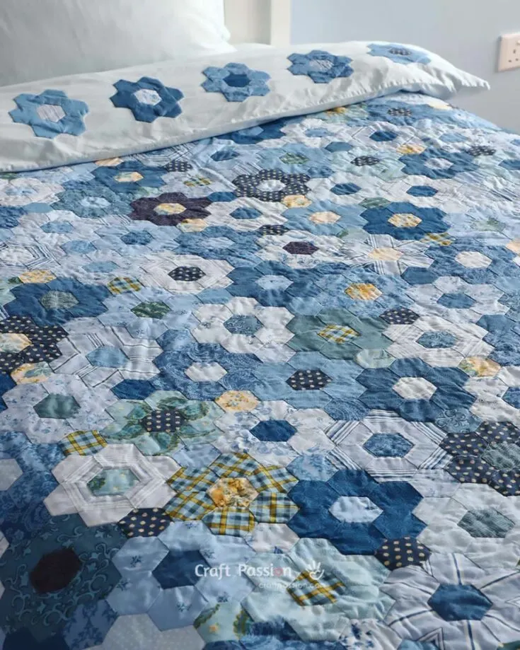 Starting in the list is one of our designs, called the Modern Hexagon Flower Quilt Duvet. It's an avid beginner's project, and it's a fast-sew scrap quilt design that is budget-friendly and results in a modern bedding quilt that is cozy, soft, and fluffy. It's constructed from the Hexagon Quilt Block method and yields a single-size duvet cover of 54" wide x 80" long.&nbsp;