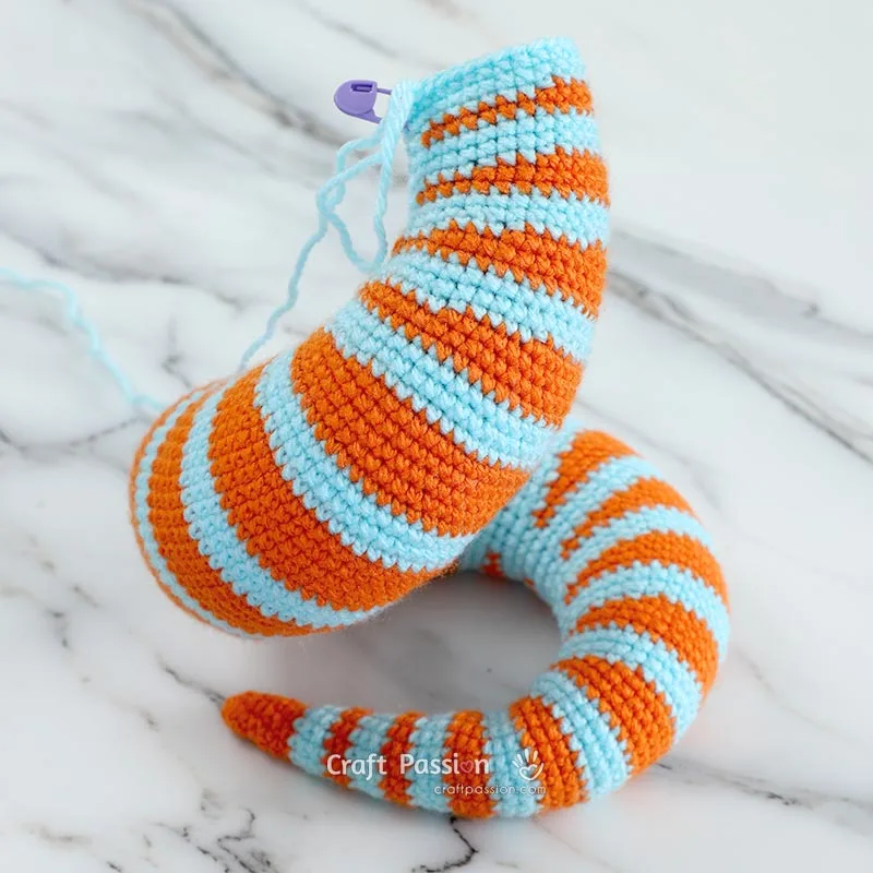 Use the free crochet snake pattern to crochet the curvy tail first, then continue with the head.