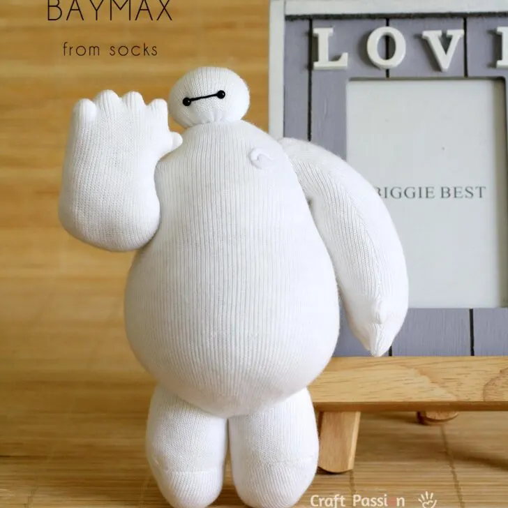 Sew a sock Baymax plush from Big Hero 6! This squishy robot has 2-dot eyes and a white balloon-like body. Free pattern and tutorial included!