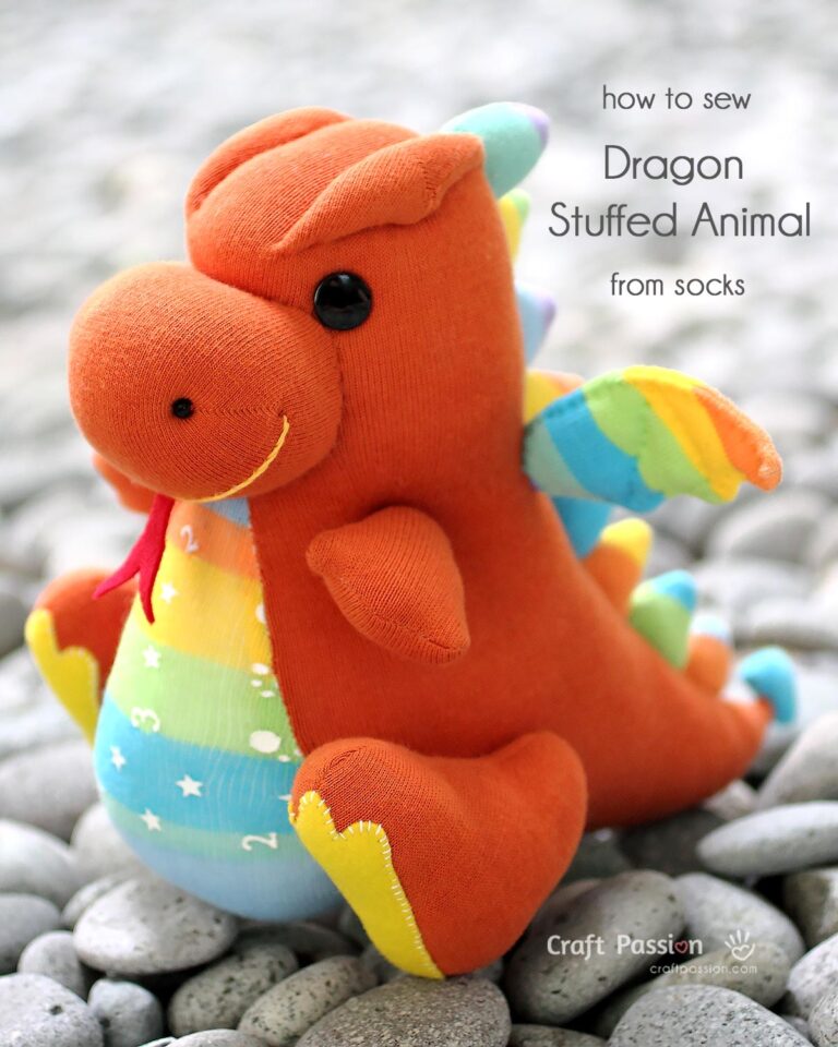 Sew a cute dragon stuffed animal, Drake, with 2 pairs of socks! Features spiky back, bat wings, and big feet. Free pattern and tutorial included!