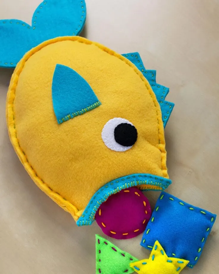 We love this hungry fish that's made of fleece and felt fabric, and comes with many pieces of fish food to feed it with. The food pieces can bed any shape you want, so it's a great way to use up fabric scraps. This is also a relatively simple and straightforward pattern, so it's perfect for beginners or even children as a project.