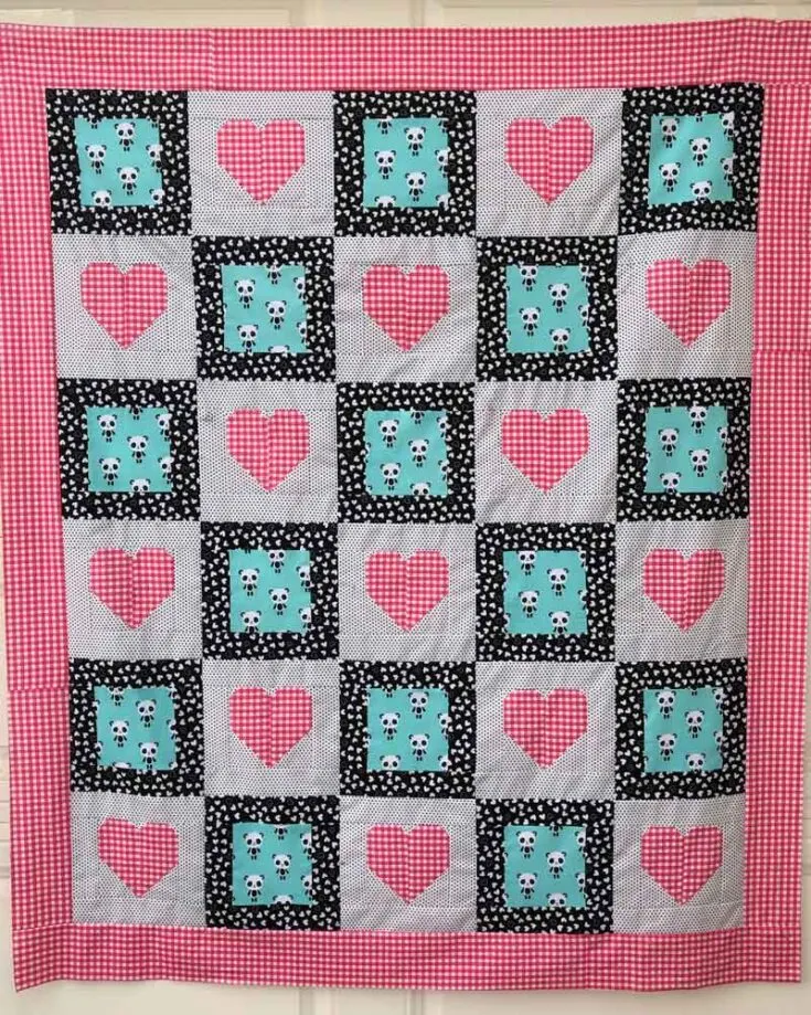 Looking for heart quilt patterns that incorporate your love for soft and squishy pandas? Say hello to the I Heart Pandas quilt! It&rsquo;s easy and straightforward to quilt, and the perfect size for a throw quilt. The finished measurements are approximately 58&rdquo; x 68&rdquo;.