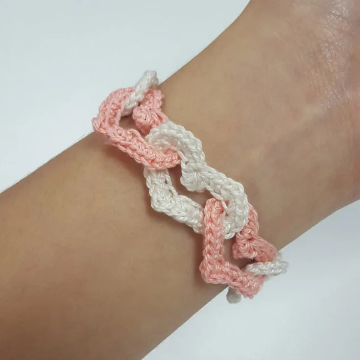 Fall head over heels for the adorable charm of the interlinked heart crochet bracelet! Crafted with love and care, learn how to intricately interlink these crochet pieces with this video guide. It's the ultimate accessory for spreading love and smiles wherever you go
