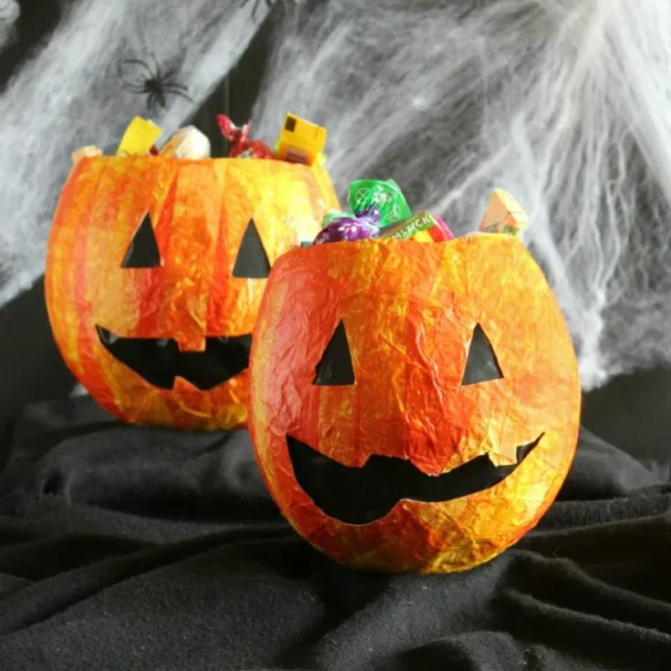 These papier-mache candy bags are a great alternative to real pumpkins; they are less messy and way less work! They're easy for kids to help create, making them a fun and fuss-free Halloween craft, and they add a playful touch to your festivities.