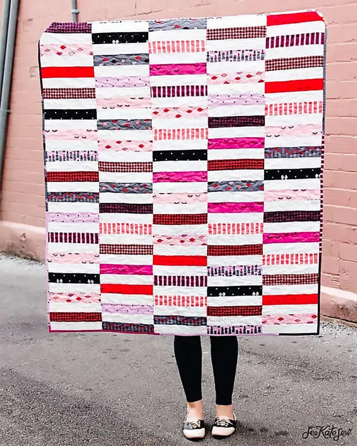 You could make a 50" x 60" Jelly Roll Strip Quilt using just one jelly roll and one piece of coordinating fabric! Don't worry if you don't have jelly rolls or rolie polies! Just snip up a few 2.5" strips of fabric and you'll be ready to try this tutorial out.