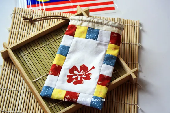 Make a small drawstring bag using this free sewing pattern and tutorial. Customize your own patchwork design by following the instructions.