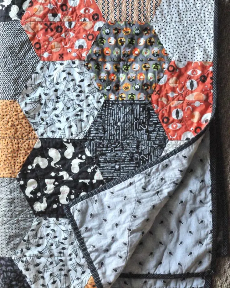 Learn to make this beautiful Halloween-themed large hexagon quilt! This design offers easy-to-follow instructions and detailed step-by-step instructions for making those half-hexagon pieces so that there are no &ldquo;Y&rdquo; seams to the piece. It&rsquo;s great for the upcoming fall season, and the finished size is 40&rdquo; x 56&rdquo;.