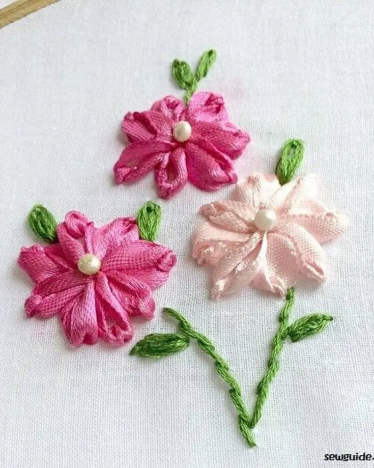 Seeking another flower embroidery pattern but with ribbons? If you already know how to do a lazy daisy stitch, this embroidery design should be easy for you. All you have to do is repeat the steps and replace your floss with ur choice of ribbon.