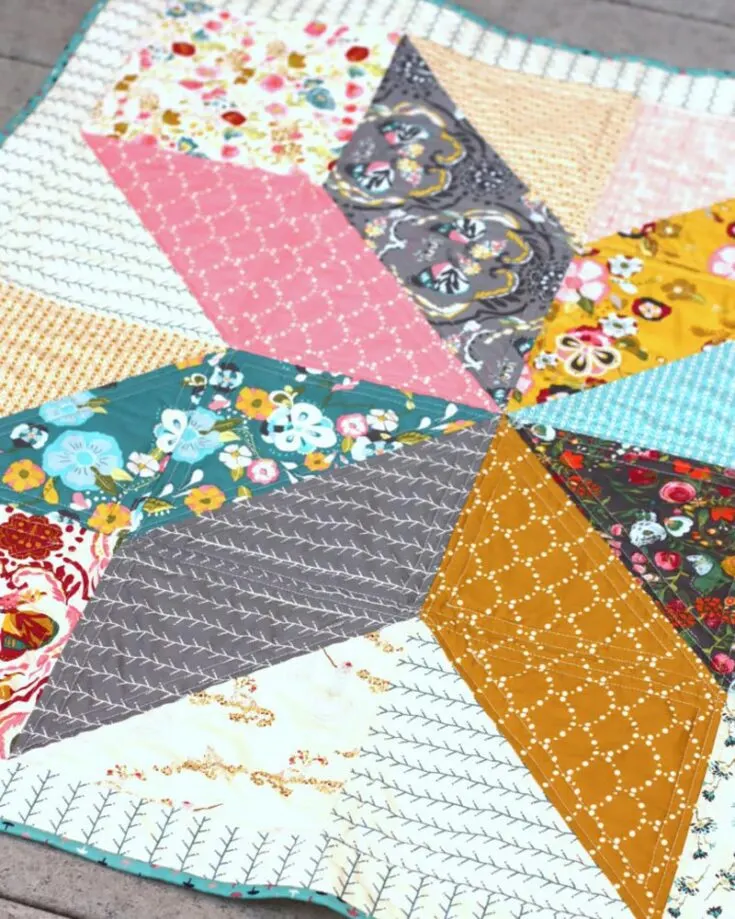 This easy quilt project comes with 2 variations for quilt layouts, such as the traditional Lone Star and Morning Star. It caters to beginners and has a simple classic star quilt block design. Not to mention, it&rsquo;s layer cake friendly! So, if you want to use pre-cuts for your HST quilts, this might be the right one. The finished size is 39&rdquo; x 39&rdquo;.