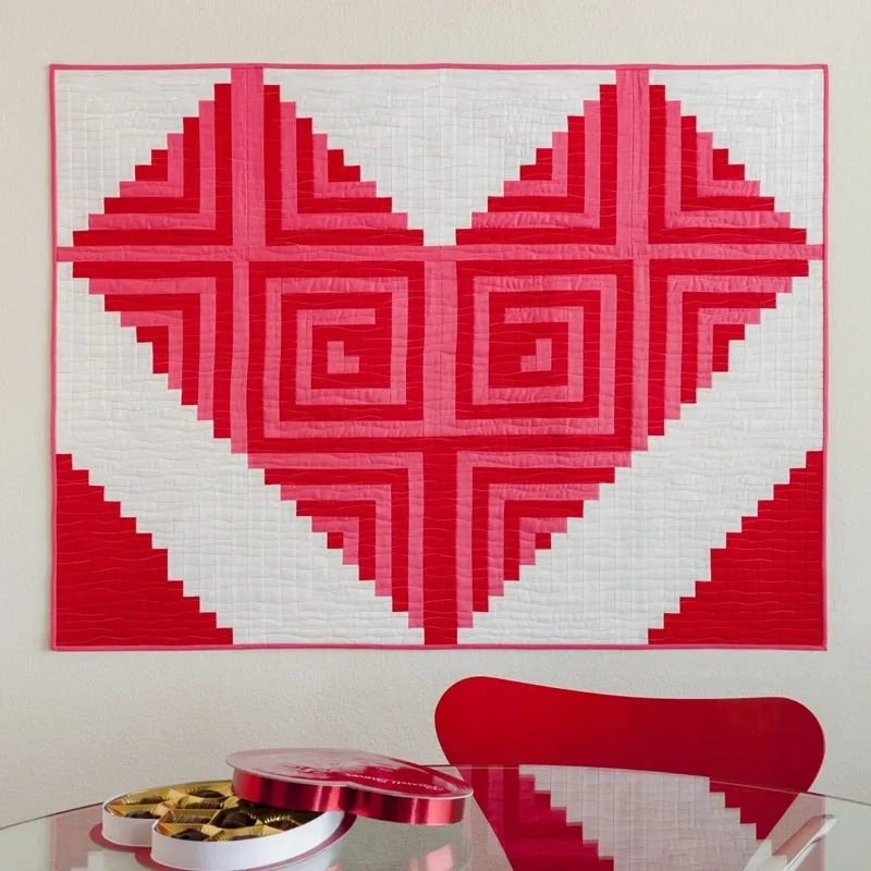 Show some love to your home decor with this immense love quilt pattern! Trust us; it&rsquo;ll add a fun accessory to your cozy home while showcasing your beautiful artwork. Whether you&rsquo;re a seasoned or beginner quilter, this project promises hours of creative fun and plenty of love stitched into every block. The finished size is 48&rdquo; x 36&rdquo;.