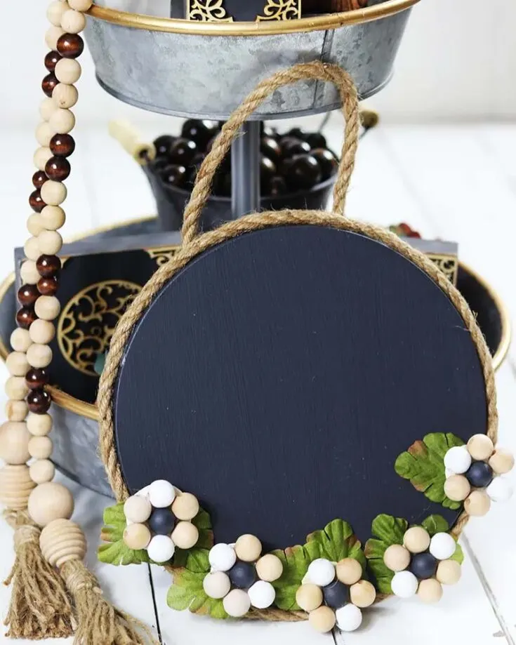 Craft a farmhouse-style magnetic memo board using dollar store items with a step-by-step guide by The Cottage Market. Keep your grocery list and reminders organized in style with this simple and quick project displayed in your kitchen.