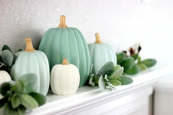 If all the loud-colored Halloween pumpkin painting ideas make your head pound, maybe these muted ones will tug at your heartstrings. Paint your pumpkins in a series of shades that will complement your interior nicely.