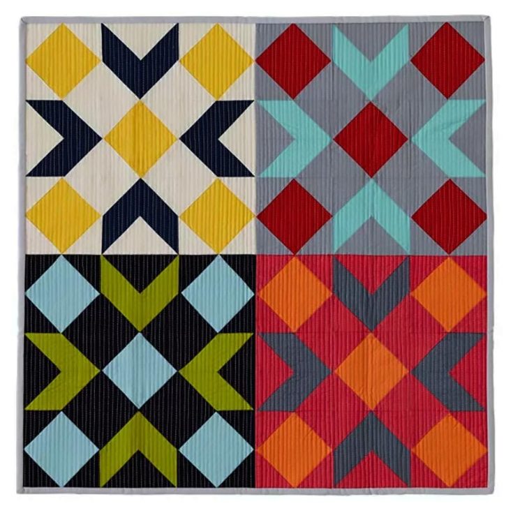 Want to explore your creativity with this piece? Click the link below to access the free instructions pack that will teach you how to quilt this 26" x 26" piece. This gorgeous yet simple design uses solid fabrics and vertical line quilting for a modern touch to a mini quilt with the essence of a barn quilt.