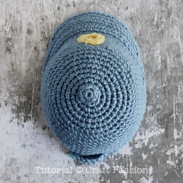 mini crochet cap with a button on top