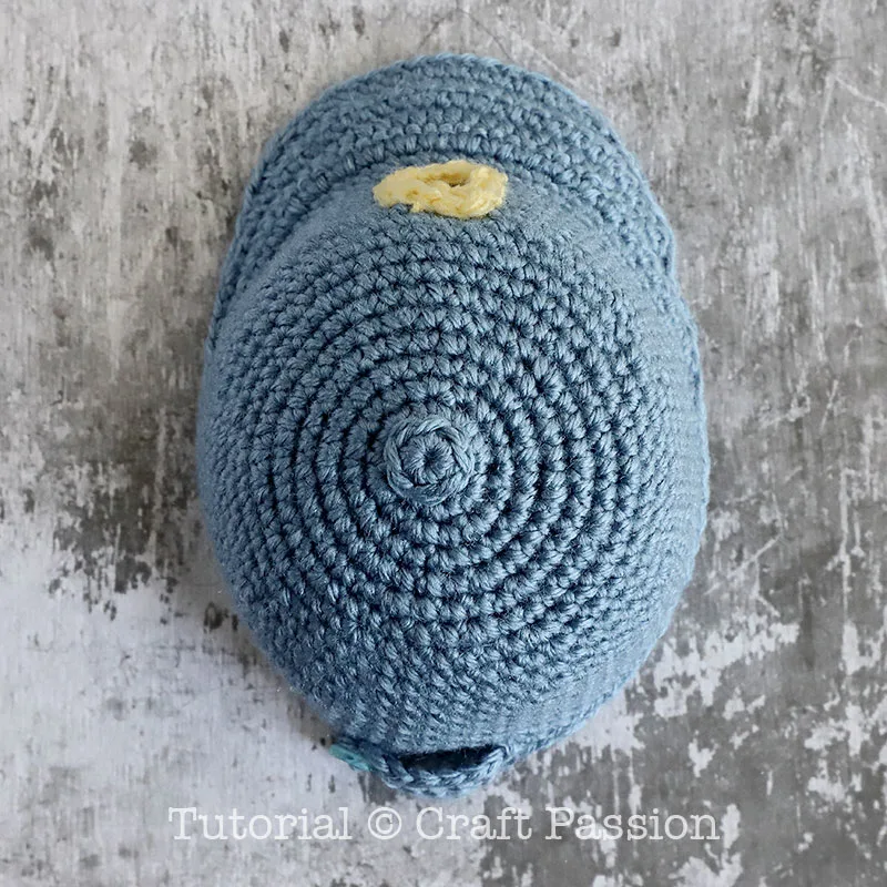 mini crochet cap with a button on top
