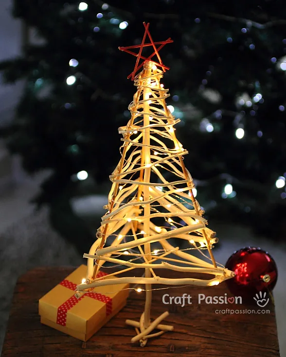 small christmas tree made from tree brunches