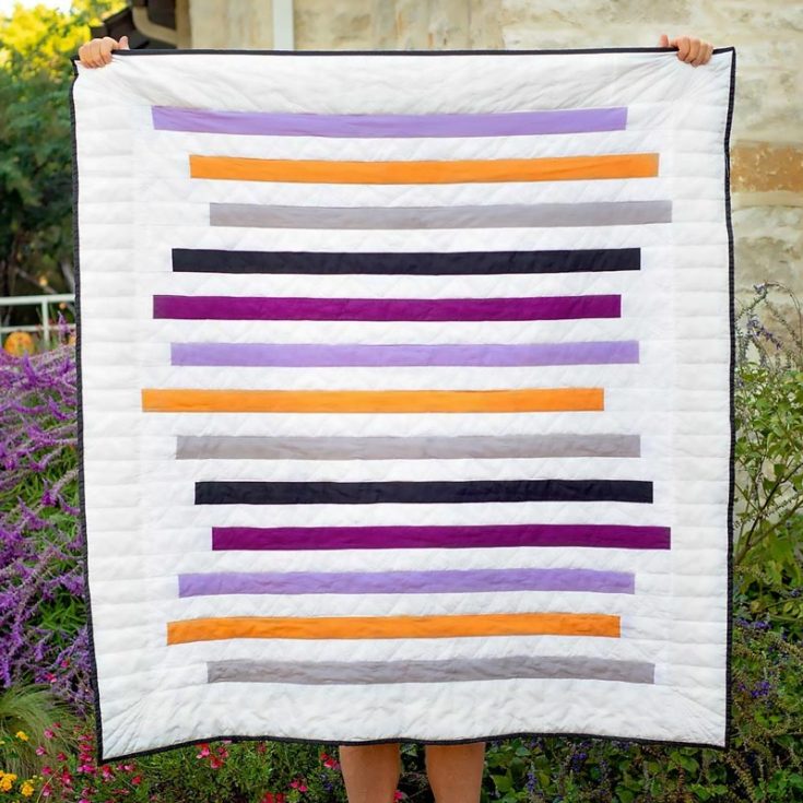 Like the Simple Striped Quilt, this Modern Strip Quilt features clean lines and a contemporary aesthetic for all the minimalist girlies. Perfect for adding a touch of modern elegance to any space, this quilt is relatively fast and uses 13 colored jelly roll strips. The finished size of this throw quilt is 55&rdquo; x 60&rdquo;.