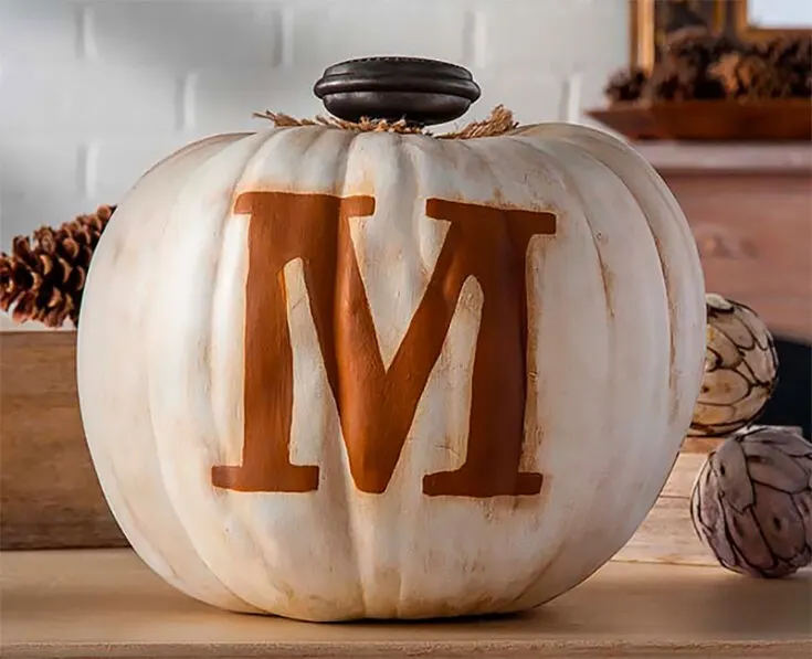 This year's theme of pumpkin painting ideas is all about letting your personality shine. And what better way to showcase that than with some monogram pumpkins?