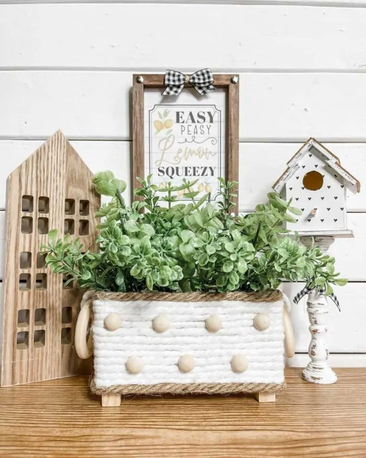 Mop strings can be so versatile, not only for keeping floors clean but also for crafts like this planter. With simple wooden boxes and a little bit of hot glue and creativity, you can create this adorable farmhouse planter!