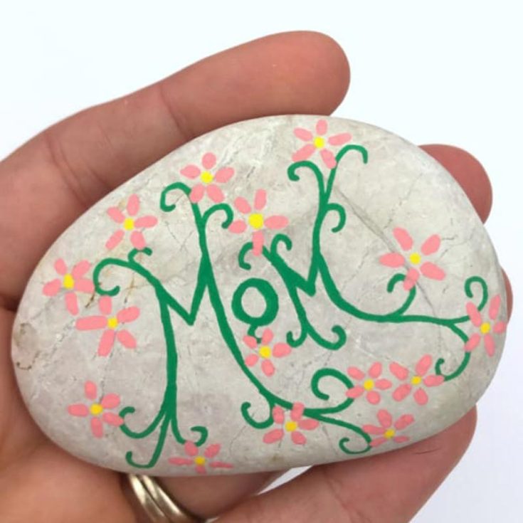 Here is another rock painting design incorporating flora and fauna on one canvas. Decorate rocks with vibrant blooms to create a mini garden that will bring joy and smiles this Mother&rsquo;s Day.