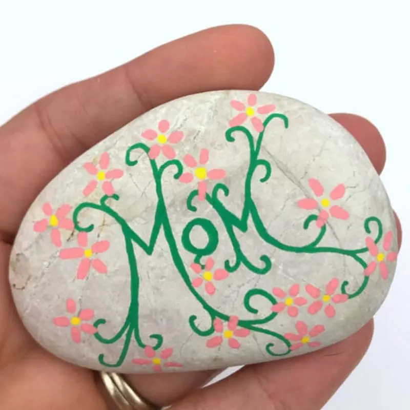 Here is another rock painting design incorporating flora and fauna on one canvas. Decorate rocks with vibrant blooms to create a mini garden that will bring joy and smiles this Mother&rsquo;s Day.