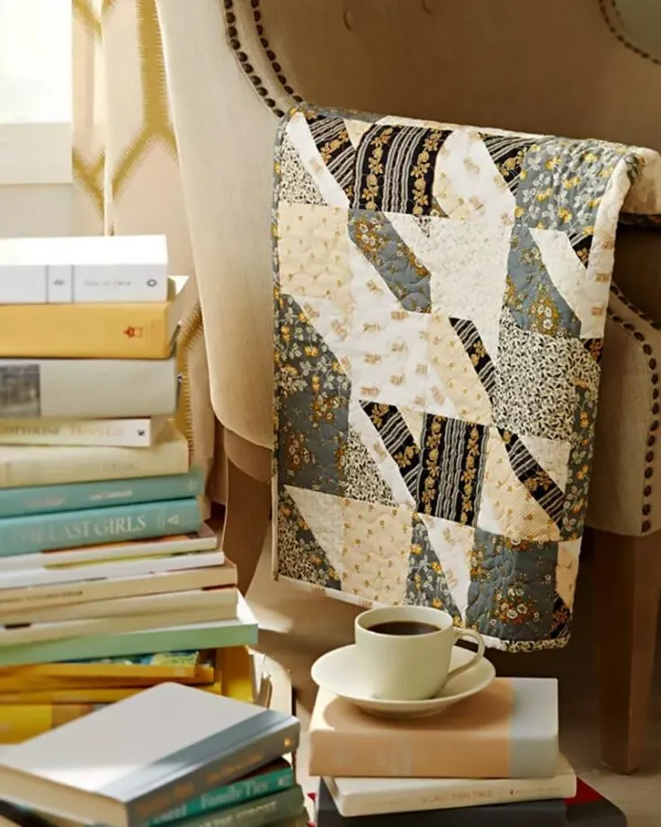 Quilt this small throw pattern to add a dash of warm colors to your living space! This pattern is ideal for quilters who love a "clean girl" and rustic aesthetic because of the neutral palette used, and the finished size of this lovely quilt is 28 &frac12;" x 32 &frac12;".&nbsp;