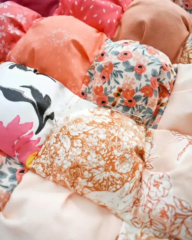 This quilt is by far our personal favorite in the list of quilt patterns for beginners! It&rsquo;s so puffy, squishy, and super cuddly! Say hello to the Ombre Puff Quilt. This pattern comes with detailed step-by-step written instructions, along with a YouTube video tutorial to teach you how you can replicate this small throw-size quilt.