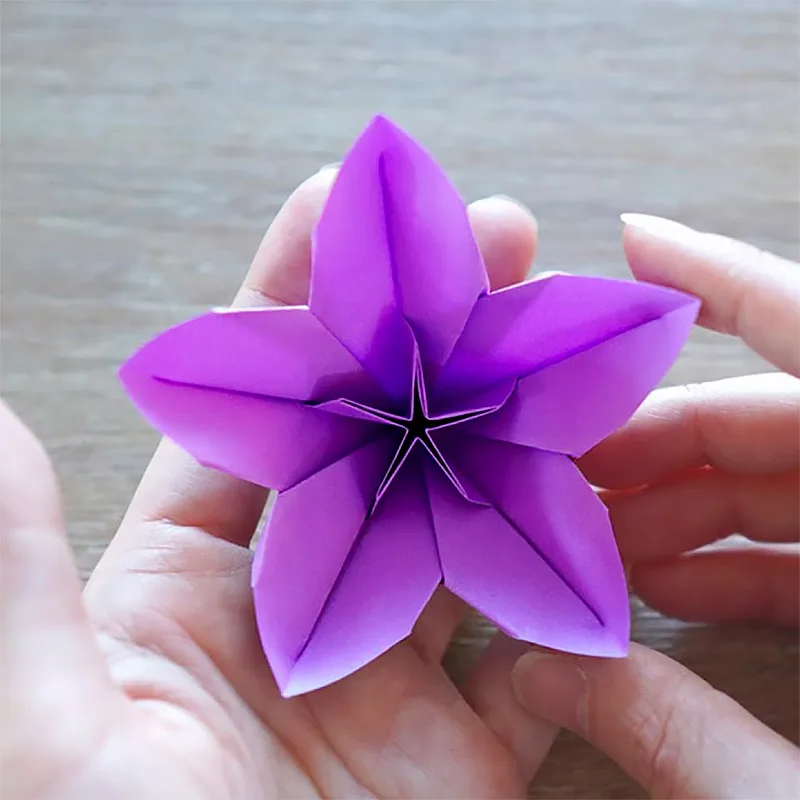 This easy flower origami is one on cherry blossoms, and it's also a video tutorial.