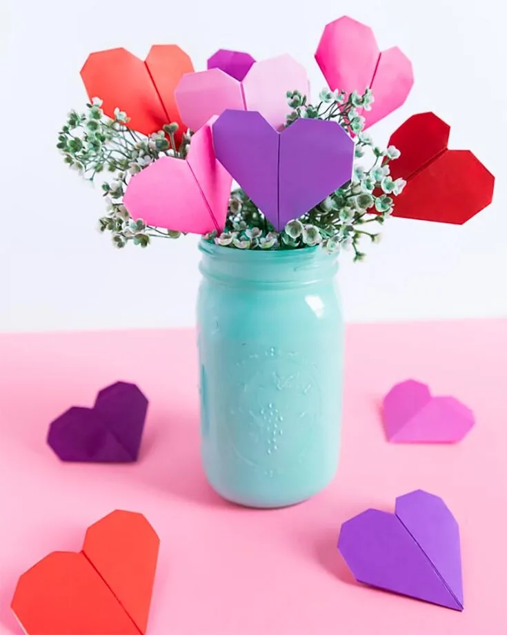This is a great Valentine's Day craft for toddlers and kids, as they can easily learn how to make origami hearts and assemble them as a bouquet.