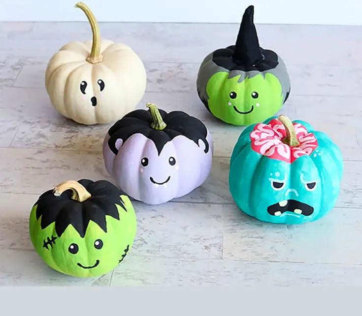 These mini pumpkins with painted monster faces are so simple even children can make them! They also make the most adorable DIY Halloween d&eacute;cor.