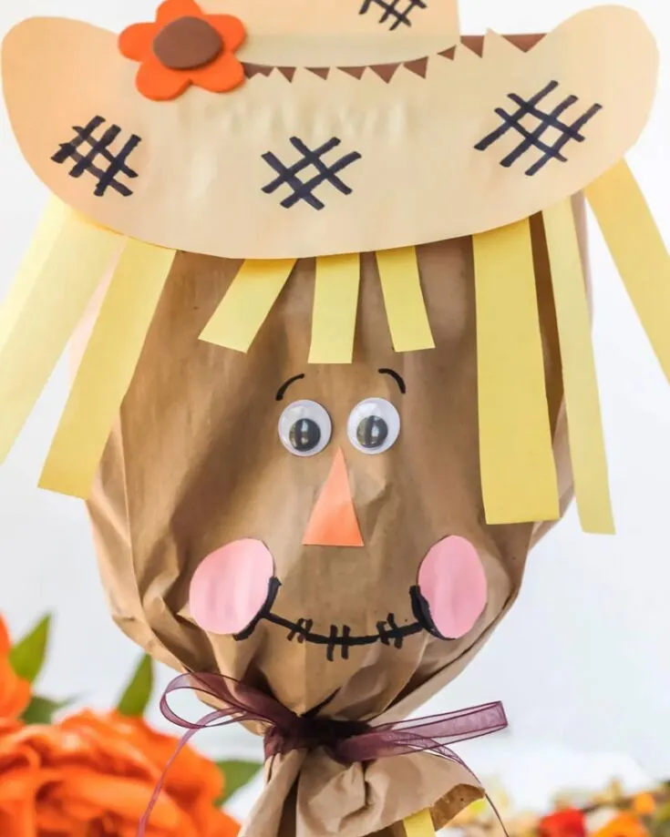 Instead of carving pumpkins this year, why not make several of these fantastic Paper Bag Scarecrows for a fun playtime session? They're effortless to make and take less than 15 minutes to craft! Try it out now.