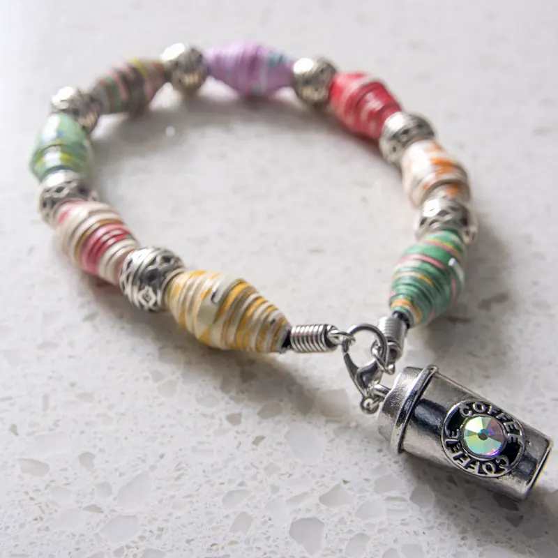 Paper beads can be surprisingly sturdy, especially for jewelry. Upcycle old colorful magazine pages into fashionable accessories like this paper bead bracelet!