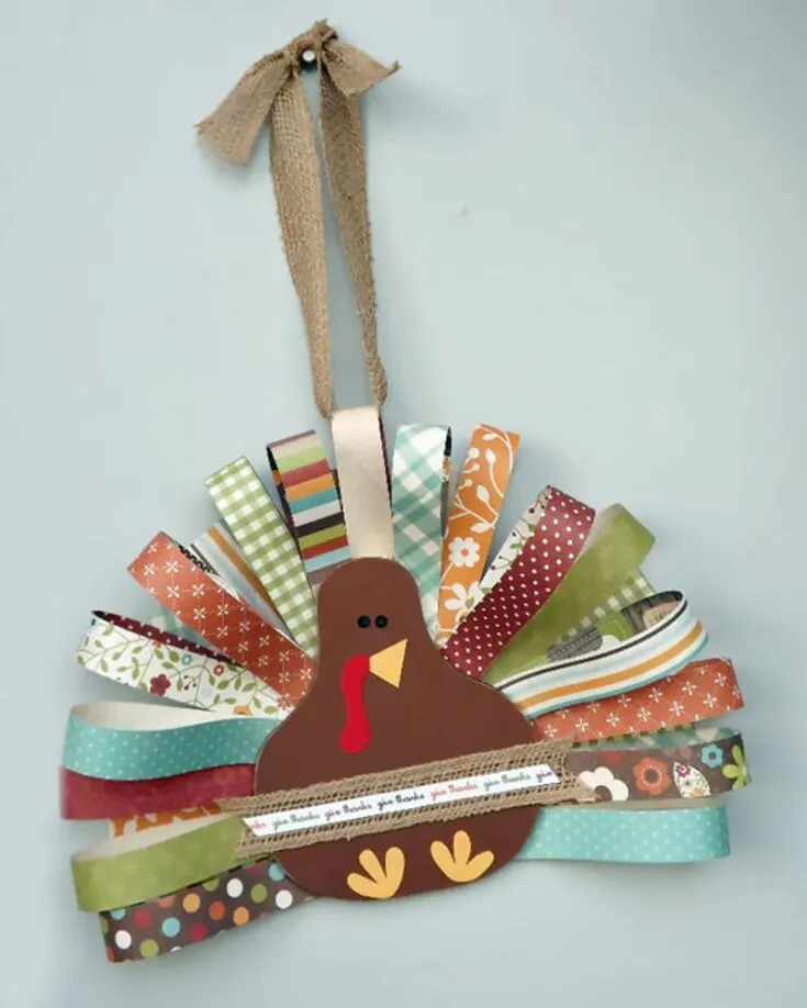 If you and your little ones love making those tiny origami stars, save up those paper strips for this fantastic project! Whether hanging it on your door, your keys, or as a keychain for your bags, this craft project promises much fun and room for creativity.