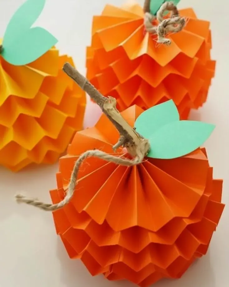 Instead of carving out pumpkins, try making these adorable paper pumpkins for your little ones. They are so effortless! All you need is some paper and voila.