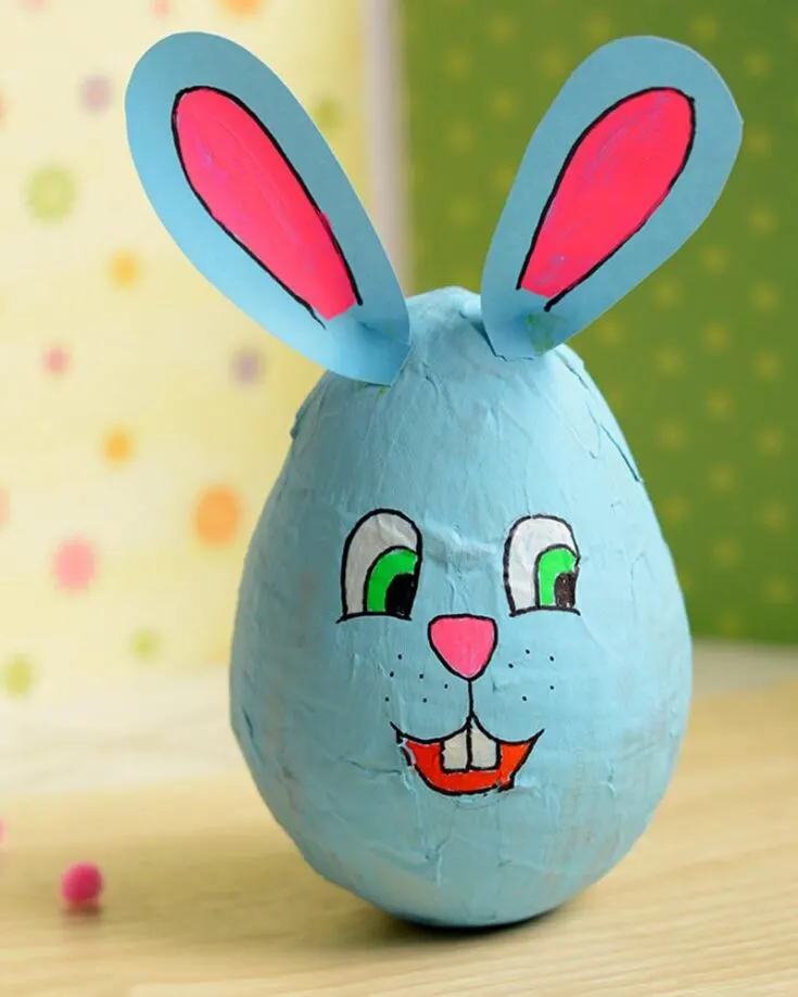 Here is a fun Easter-time activity to make a cute wobbling papier mache bunny. Although it doesn't seem possible, use a balloon to create this nice oval egg shape.