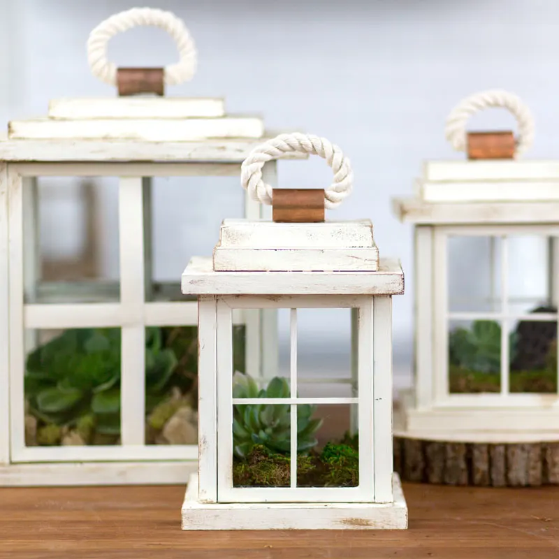 For less than $10, you can illuminate your garden or balcony with your very own decorative lanterns using picture frames. Once the frames are dry from white chalk paint, you can either leave as is or lightly sand and stain the edges for a distressed look to achieve that rustic charm.